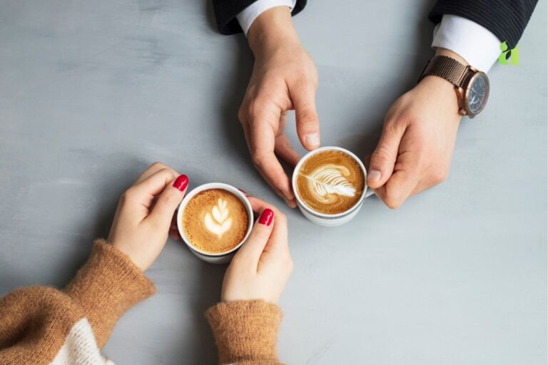 Two people communicating mindfully over coffee — Aarohi Blog on emotional connection