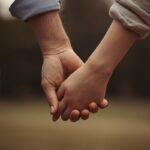 Couple holding hands with emotional connection – the real key to deep love – Aarohi Blog