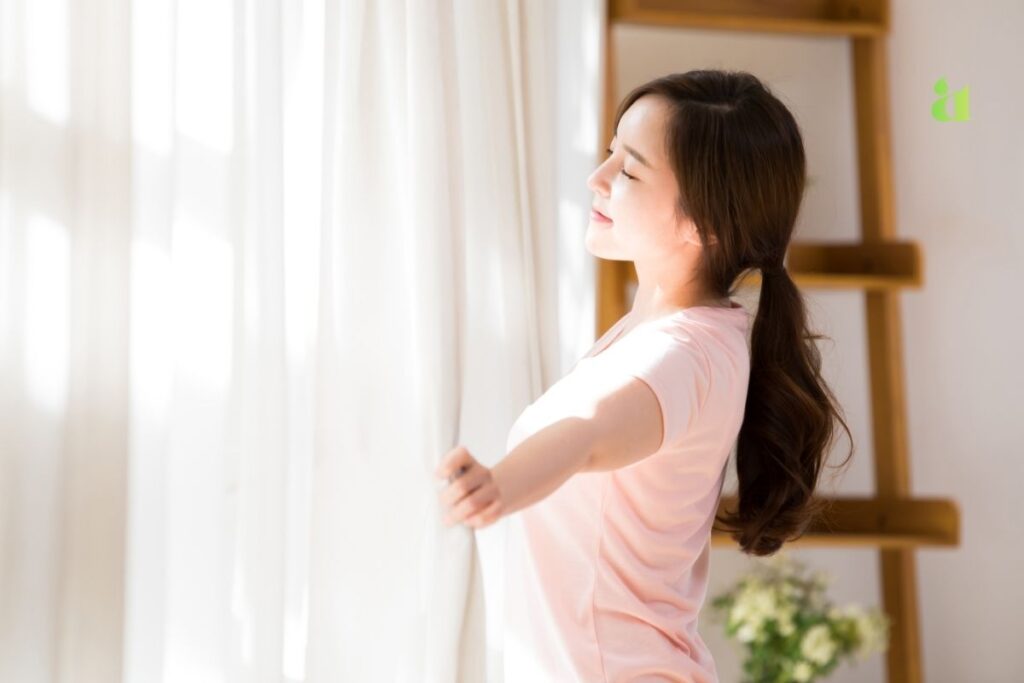 10 Self-Care Tips for a Happier, Healthier, and More Balanced Life Woman practicing mindful morning self-care with tea and sunlight — Aarohi Lifestyle Blog