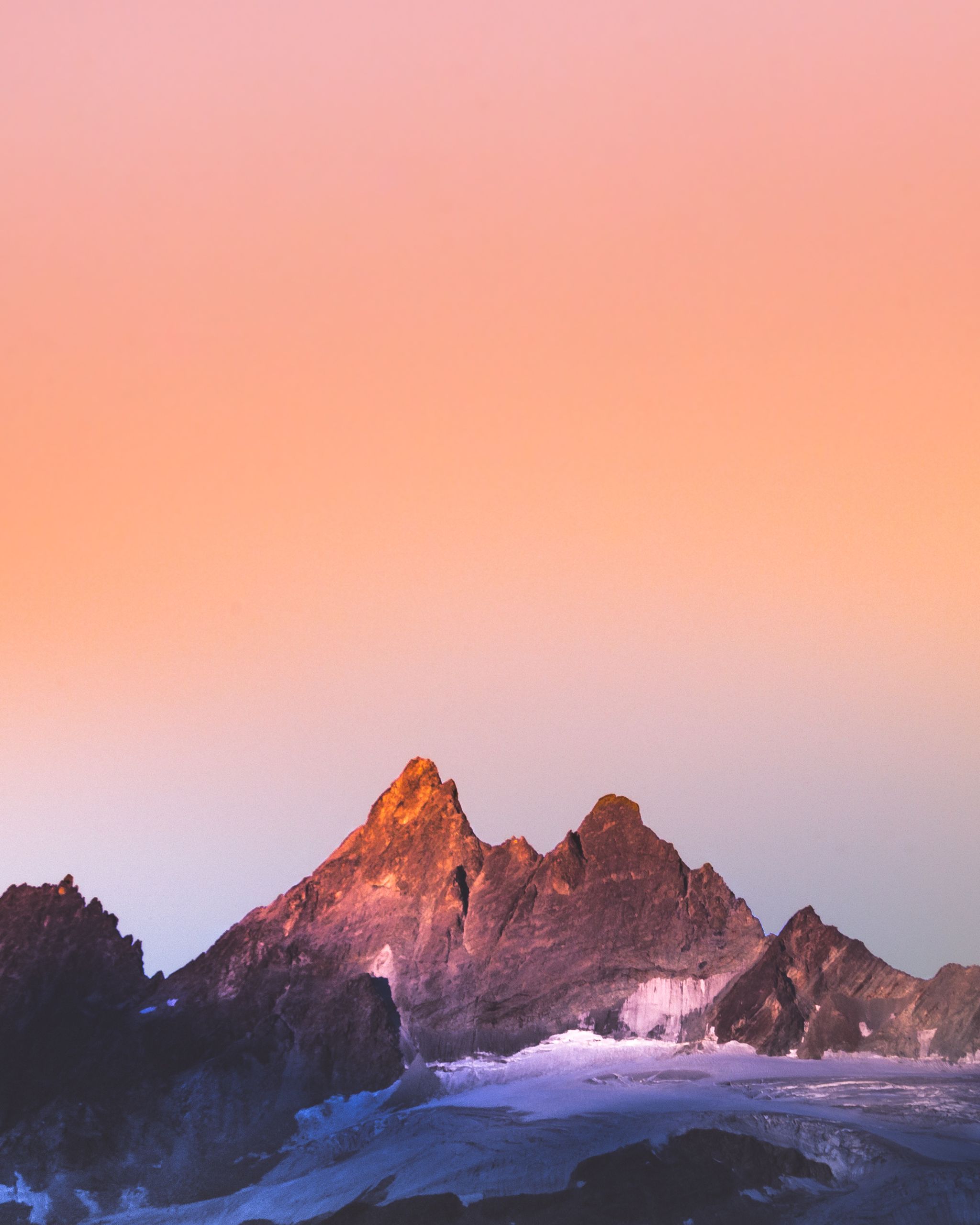 Mountain landscape with warm earth tones and solid rock formations, symbolizing grounding and stability