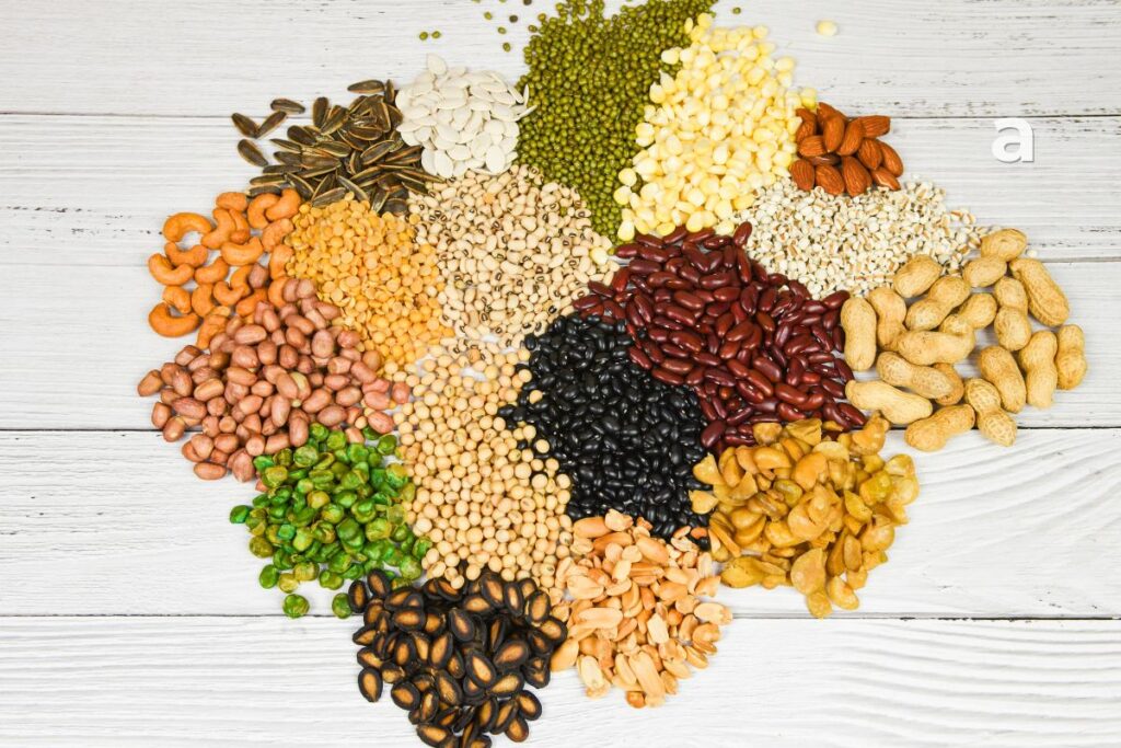 Colourful assortment of fruits, vegetables, whole grains, yoghurt, legumes, and fermented foods that support gut health.