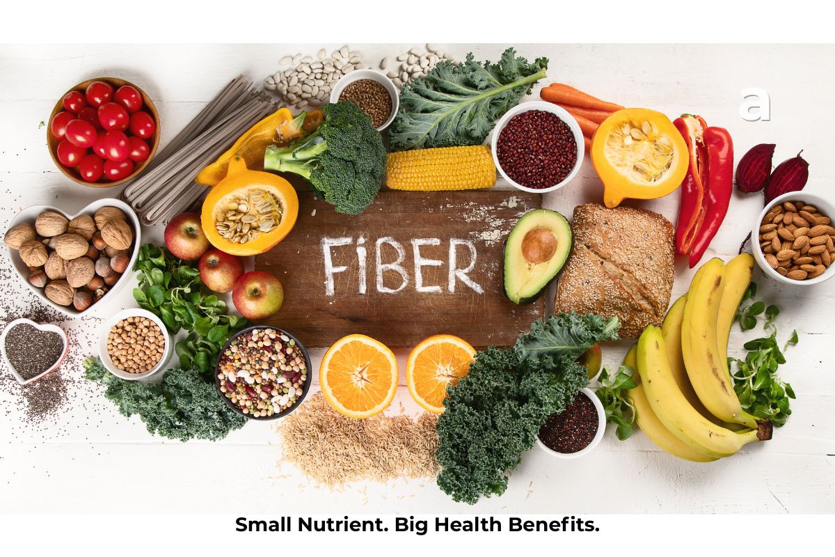 A colorful assortment of high-fiber foods including oats, lentils, beans, apples, pears, broccoli, chia seeds, whole grains, nuts, and vegetables representing a healthy, fiber-rich diet.