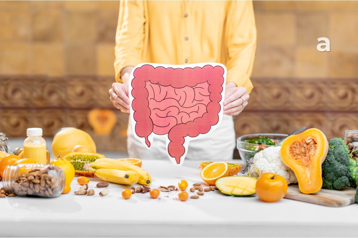 Illustration of a healthy digestive system with colourful fruits, vegetables, whole grains, and beneficial gut bacteria representing gut health and overall wellness.