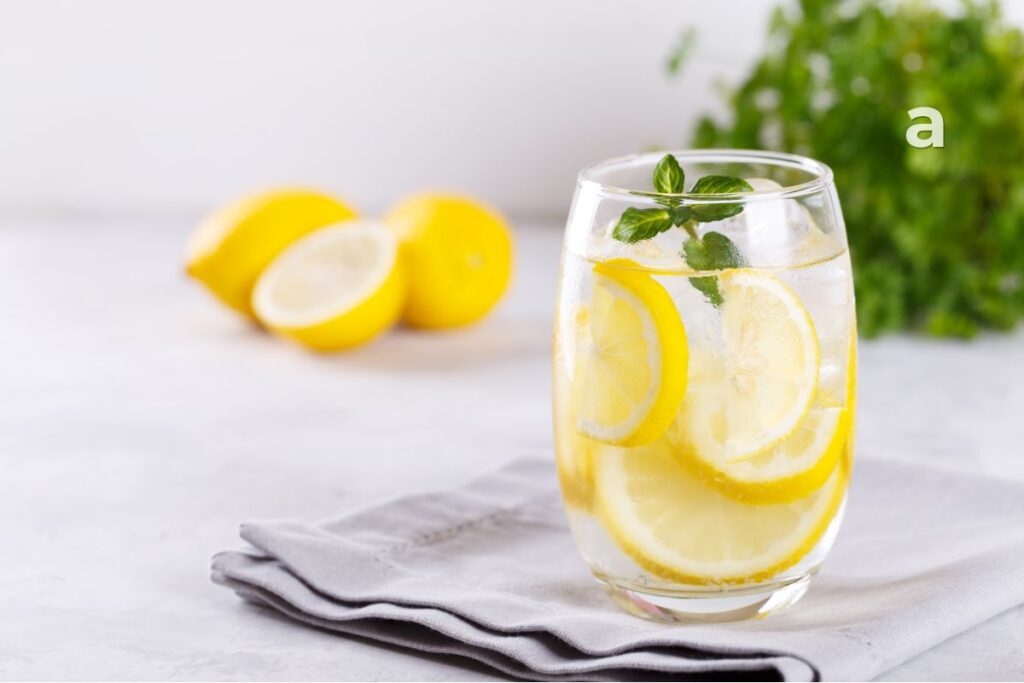 Hydration and daily water intake with a glass of water and water-rich fruits