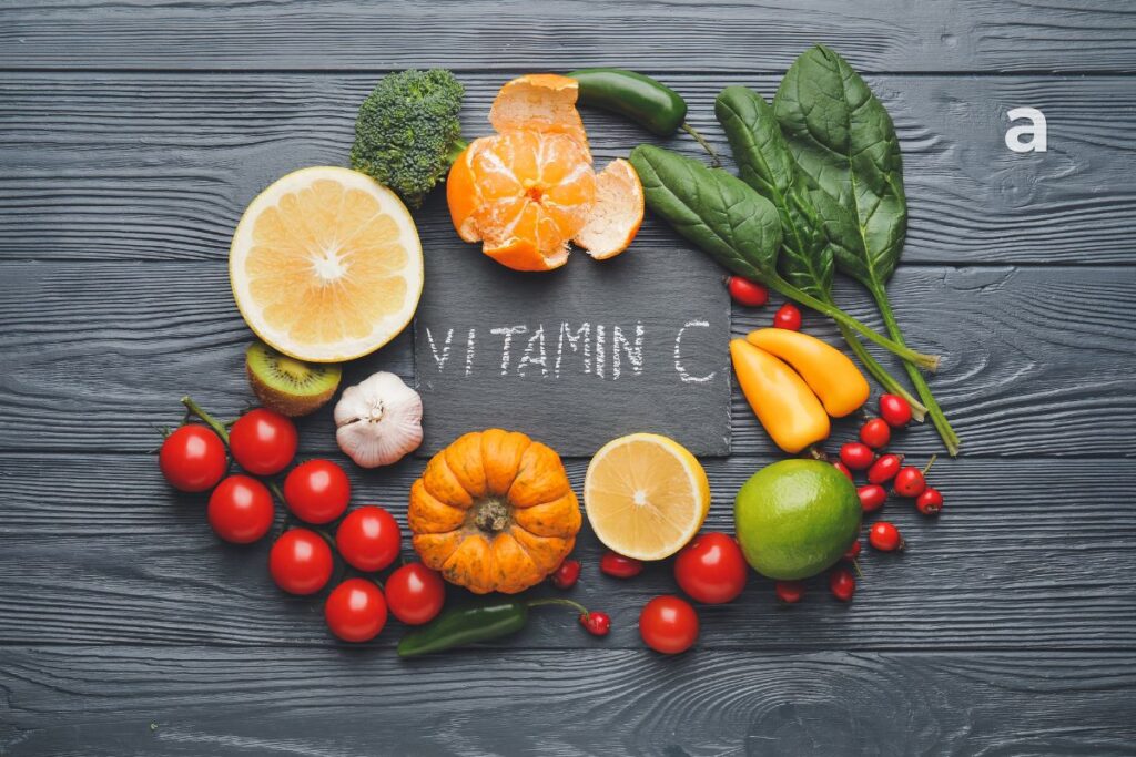 Vitamin C-rich foods including guava, amla, oranges, kiwi, strawberries, bell peppers, broccoli, tomatoes, papaya, and lemon supporting immunity, collagen production, healthy skin, and antioxidant protection.
